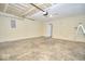 A clean and spacious garage interior with ample room for parking and storage at 5424 Milhouse Rd, Indianapolis, IN 46221