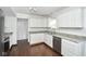 Spacious kitchen featuring white cabinetry, granite countertops, and stainless-steel appliances at 5424 Milhouse Rd, Indianapolis, IN 46221