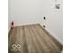 Efficient utility room featuring durable floors, perfect for laundry and storage needs at 5424 Milhouse Rd, Indianapolis, IN 46221