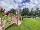 Enjoy the outdoors on this back deck overlooking a pond and lush green lawn at 5441 Red Hawk Ln, Greenwood, IN 46142