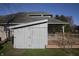 Backyard view features a deck and storage shed, offering space for relaxation and organization at 5441 Red Hawk Ln, Greenwood, IN 46142