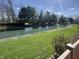 Lush green backyard that leads to a beautiful view of the lake, perfect for entertaining guests at 5441 Red Hawk Ln, Greenwood, IN 46142