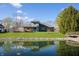 Expansive backyard with a pond, bridge, and a two-tiered deck, great for entertaining at 5441 Red Hawk Ln, Greenwood, IN 46142