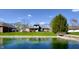 This home boasts a lake view and well-manicured lawn, creating a serene outdoor retreat at 5441 Red Hawk Ln, Greenwood, IN 46142
