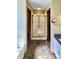 Bathroom with a bathtub, shower with glass door, decorative mirrors and lighting fixtures at 5441 Red Hawk Ln, Greenwood, IN 46142