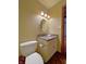 Well-lit bathroom with a vanity, round mirror, and a toilet with a classic design at 5441 Red Hawk Ln, Greenwood, IN 46142