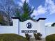 Brookstone community entrance with a white brick wall, black trim and a logo featuring the letter 'B' at 5441 Red Hawk Ln, Greenwood, IN 46142