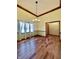 Dining room features hardwood floors, chandelier, and large windows at 5441 Red Hawk Ln, Greenwood, IN 46142