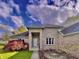 Close up of a brick facade with covered front door and attractive landscaping at 5441 Red Hawk Ln, Greenwood, IN 46142