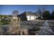 Exterior view of the attached three car garage, with a long driveway, providing ample parking space at 5441 Red Hawk Ln, Greenwood, IN 46142