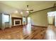 Spacious living room with fireplace, hardwood floors, and natural light at 5441 Red Hawk Ln, Greenwood, IN 46142