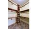 Well-organized walk-in closet offering a combination of shelves and hanging space at 5441 Red Hawk Ln, Greenwood, IN 46142