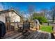 Outdoor backyard deck area with table, chairs, and privacy fence at 5442 Hibben Ave, Indianapolis, IN 46219