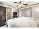 Modern bedroom with a ceiling fan and minimalist decor at 5442 Hibben Ave, Indianapolis, IN 46219