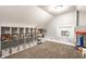 Large carpeted bonus room with lots of storage, window A/C, and playing area at 5442 Hibben Ave, Indianapolis, IN 46219