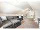Spacious carpeted bonus room with cozy seating, shelving and entertainment area at 5442 Hibben Ave, Indianapolis, IN 46219