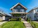 Inviting two-story home with a well-manicured lawn and classic architectural details at 5442 Hibben Ave, Indianapolis, IN 46219