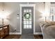 Welcoming entryway featuring a stylish front door and neutral interior design at 5442 Hibben Ave, Indianapolis, IN 46219