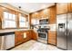 Updated kitchen features stainless steel appliances, granite countertops, and ample cabinet space at 5442 Hibben Ave, Indianapolis, IN 46219
