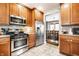 Charming kitchen provides stainless appliances, stylish cabinets, and a view to the dining area at 5442 Hibben Ave, Indianapolis, IN 46219
