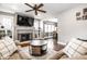 Comfortable living room featuring a fireplace and open access to the dining area at 5442 Hibben Ave, Indianapolis, IN 46219