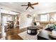 Open-concept living area with a view of the dining room and hardwood floors at 5442 Hibben Ave, Indianapolis, IN 46219
