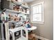 A walk-in pantry with generous shelving, a window for natural light, and storage for any Gathering at 5442 Hibben Ave, Indianapolis, IN 46219