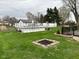 Spacious backyard featuring a white above-ground pool and fire pit perfect for entertaining at 5626 Hammon Dr, Brownsburg, IN 46112