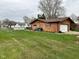 Spacious backyard with healthy lawn and partial fencing provides ample room for recreation at 5626 Hammon Dr, Brownsburg, IN 46112