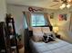 Serene bedroom featuring soft lighting, neutral decor, and a cozy bed with decorative pillows at 5626 Hammon Dr, Brownsburg, IN 46112