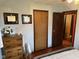 Bedroom with a dresser adorned with diplomas and decorative items at 5626 Hammon Dr, Brownsburg, IN 46112
