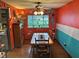 This dining room features a wooden table, ceiling fan, and a window with natural light at 5626 Hammon Dr, Brownsburg, IN 46112