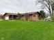 Charming single-story home with well-manicured front lawn, landscaping, and attached garage at 5626 Hammon Dr, Brownsburg, IN 46112