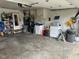 Organized garage space with laundry appliances, storage shelves, and various household supplies at 5626 Hammon Dr, Brownsburg, IN 46112