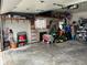 Spacious garage with ample storage, featuring a variety of tools, equipment, and a ladder at 5626 Hammon Dr, Brownsburg, IN 46112