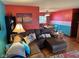Comfortable living room area seamlessly flows into the adjacent dining area with vibrant color schemes at 5626 Hammon Dr, Brownsburg, IN 46112