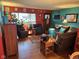 Inviting living room featuring hardwood floors, ample seating, and vibrant, colorful decor at 5626 Hammon Dr, Brownsburg, IN 46112