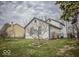 Spacious backyard with green grass and mature trees, perfect for outdoor activities and Gathering gatherings at 5752 Echo Way, Indianapolis, IN 46278