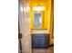 Bright bathroom features a single sink vanity with granite countertops and modern lighting at 5752 Echo Way, Indianapolis, IN 46278