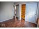 Bedroom with hardwood flooring and large closet with sliding doors at 5752 Echo Way, Indianapolis, IN 46278