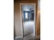 Bedroom view through doorway boasts neutral carpet, ceiling fan, and closet at 5752 Echo Way, Indianapolis, IN 46278