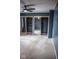 Spacious bedroom with plush carpeting, ceiling fan, and double mirrored closets at 5752 Echo Way, Indianapolis, IN 46278