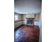 Living room featuring hardwood floors and a brick fireplace at 5752 Echo Way, Indianapolis, IN 46278
