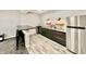 This finished basement bar includes a stainless steel refrigerator, stylish lighting, and bar stool seating at 5802 Bentbrook Dr, Bargersville, IN 46106