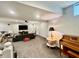 Open basement boasts recessed lighting, gray carpet, and entertainment options like a piano and television at 5802 Bentbrook Dr, Bargersville, IN 46106