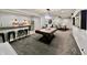 The finished basement has a bar, game area, and lounge, with plenty of room for activities at 5802 Bentbrook Dr, Bargersville, IN 46106