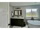 Modern bathroom featuring a large vanity and free-standing tub at 5802 Bentbrook Dr, Bargersville, IN 46106