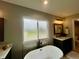 Bathroom with large window over soaking tub and vanity at 5802 Bentbrook Dr, Bargersville, IN 46106