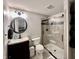 Bathroom featuring a glass-enclosed shower, gray tile, white toilet, and dark wood vanity at 5802 Bentbrook Dr, Bargersville, IN 46106