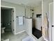 Modern bathroom featuring tiled walk-in shower with a glass partition and niche, and updated flooring at 5802 Bentbrook Dr, Bargersville, IN 46106